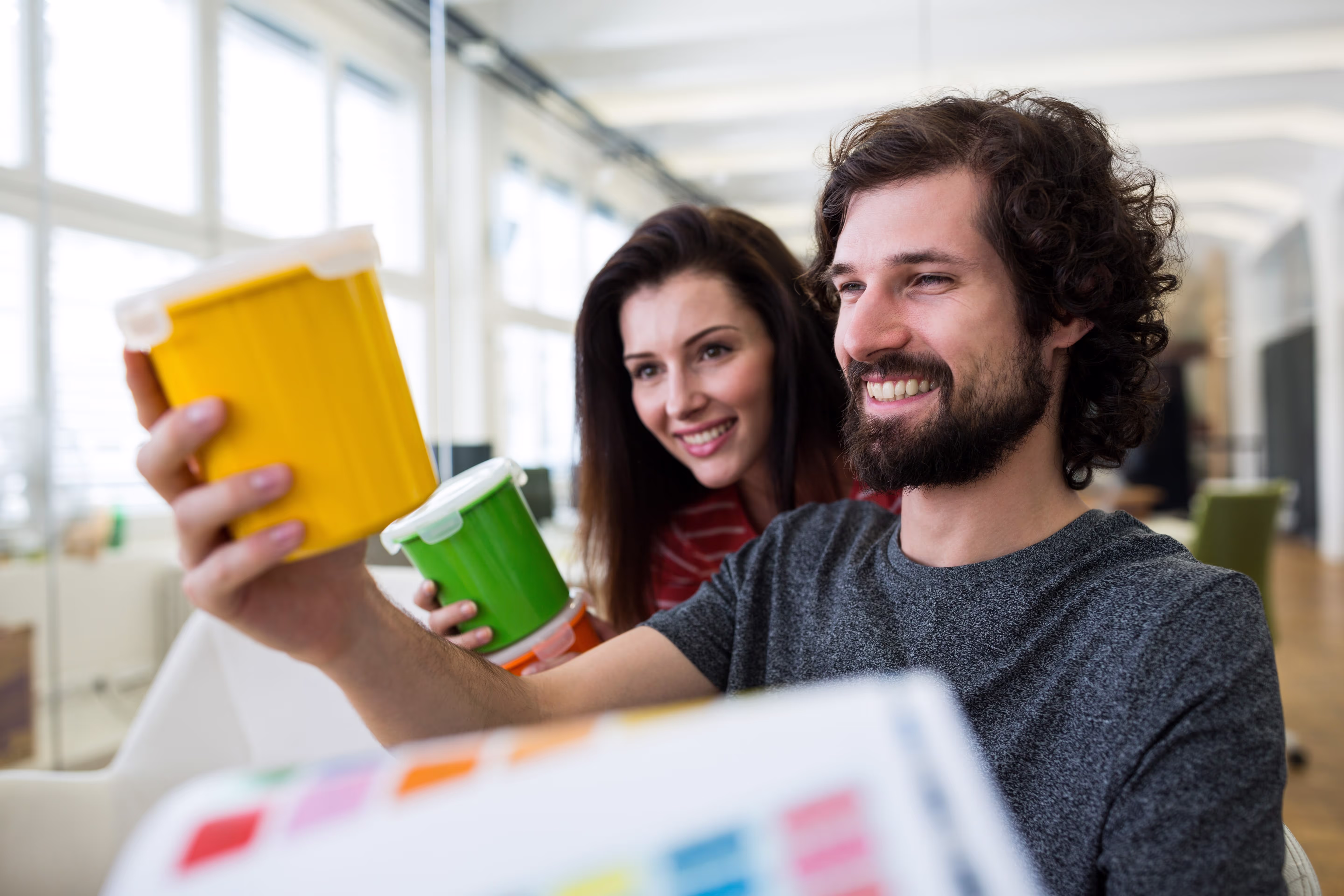 male and female working together in office